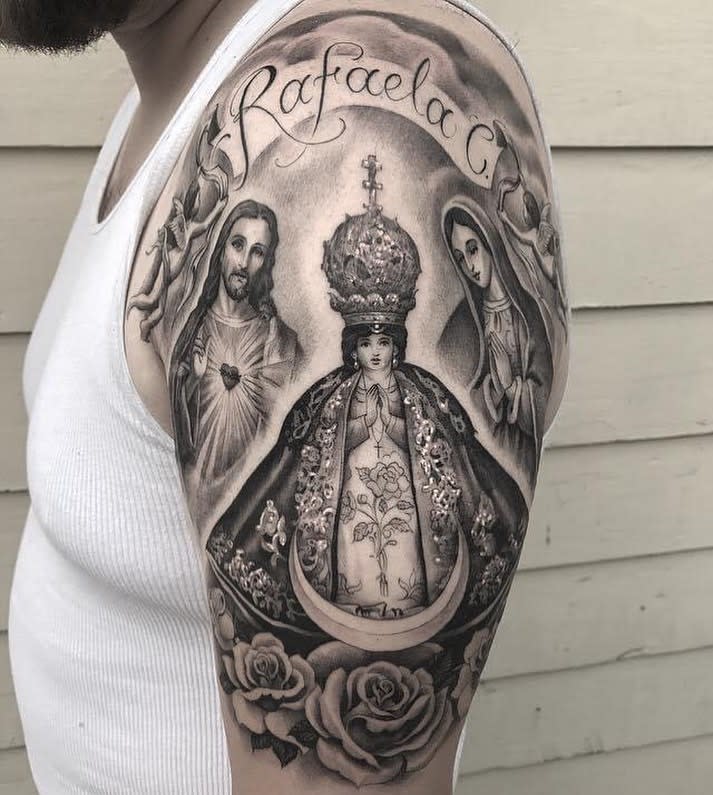 Religious tattoo depicting Jesus and Mary with intricate details on a man's upper arm